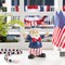 Set of 2 9"H Patriotic/ Americana Polyresin Santa holding flags Table Decor